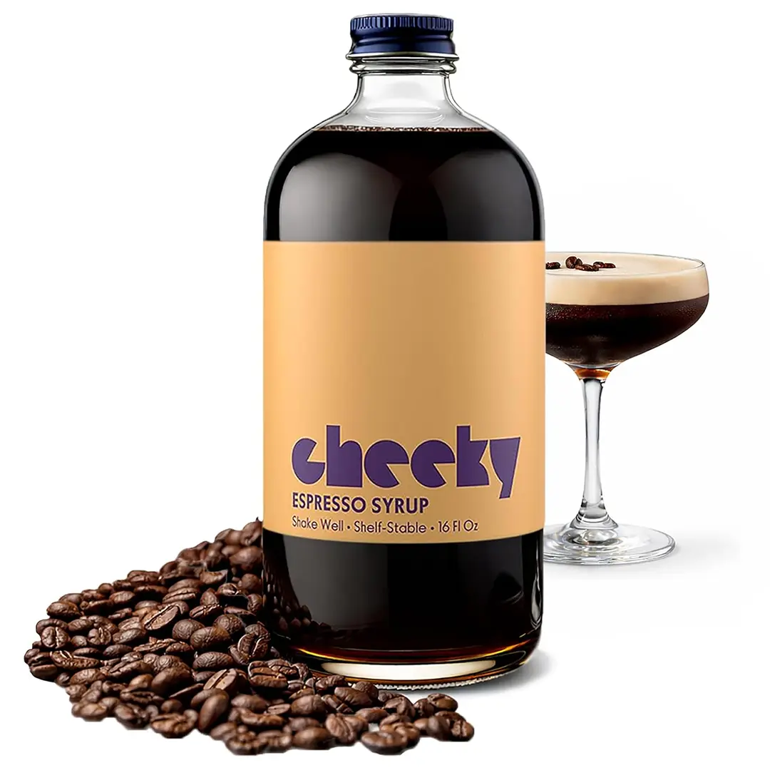 Cheeky espresso syrup beside an espresso martini and coffee beans